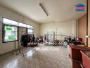 Spacious multipurpose room with tiled flooring and large windows