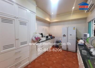 Spacious kitchen with ample storage and modern appliances