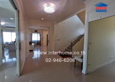 Spacious entrance hall with staircase and access to main living areas
