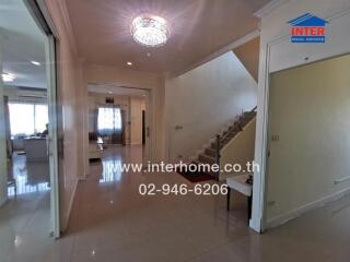 Spacious entrance hall with staircase and access to main living areas