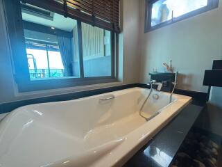Luxurious bathroom with sleek bathtub and ocean view