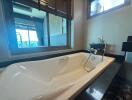 Luxurious bathroom with sleek bathtub and ocean view