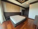 Spacious bedroom with elegant wooden decor