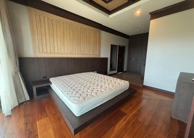 Spacious bedroom with elegant wooden decor