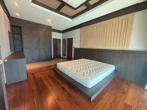 Spacious bedroom with elegant wooden finishes