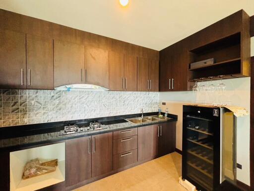 Modern kitchen with wooden cabinets and built-in appliances