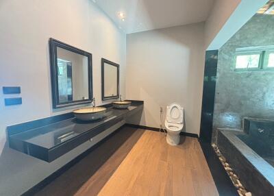 Spacious modern bathroom with dual sinks and stylish design