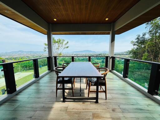 Spacious patio with panoramic view and wooden dining table