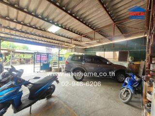 Spacious covered garage with multiple vehicles