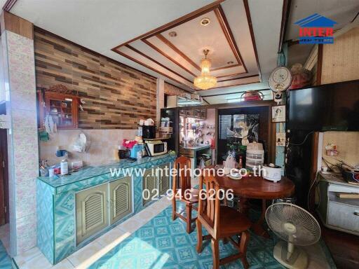 Spacious and well-lit kitchen with traditional decor and ample seating