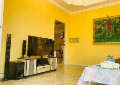 Bright and spacious living room with yellow walls and modern decor