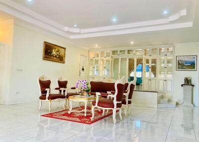 Elegant spacious living room with classic furniture and bright interior