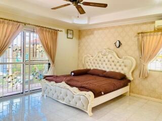 Elegant bedroom with classic design and ample natural light