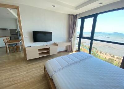 Spacious bedroom with ocean view and modern amenities