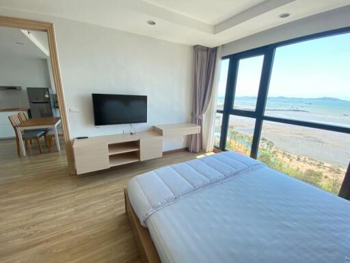Spacious bedroom with ocean view and modern amenities