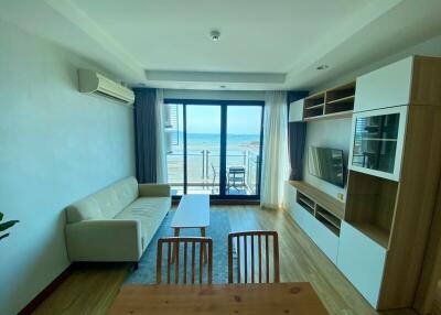 Spacious living room with ocean view and modern furnishings