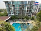 Exterior view of a modern residential building with swimming pool