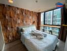 Contemporary bedroom with wooden wall decor and city view