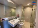 Modern bathroom interior with glass shower and mirrored vanity