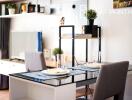 Elegantly set dining table in a modern living space with shelving and decor