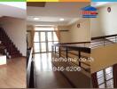 Spacious hallway and stairwell area of a modern home