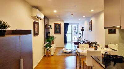 Spacious and well-lit living room with modern furniture and open plan layout