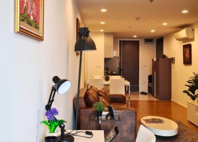 Spacious and modern living room with adjacent kitchen