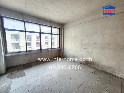 Spacious unfurnished bedroom with large windows