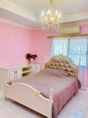 Elegant bedroom with pink walls and white furniture