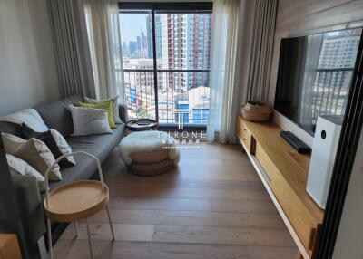 Modern living room with city view and balcony access