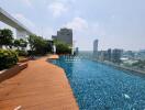 Luxurious rooftop swimming pool with city views and wooden decking