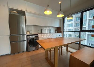 Modern kitchen with stainless steel appliances and a view of the city
