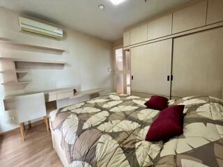 Spacious bedroom with modern design and ample storage