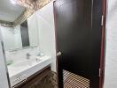 Modern bathroom with textured walls and sleek furnishings