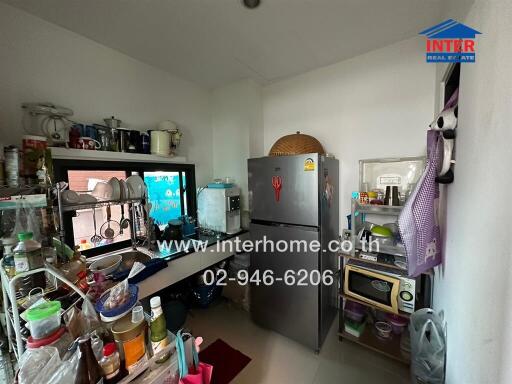 Compact and fully-equipped kitchen with various appliances