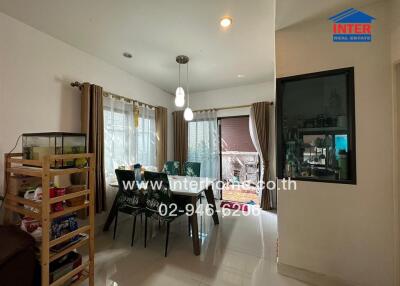 Spacious and well-lit living room with dining area