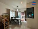 Spacious and well-lit living room with dining area