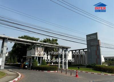 Entrance gate of modern residential complex with security