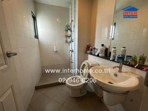 Clean and well-lit bathroom with modern amenities