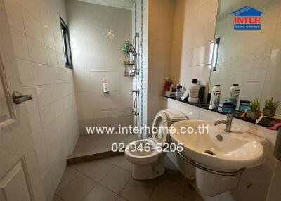 Clean and well-lit bathroom with modern amenities