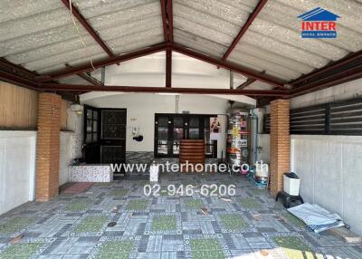 Spacious garage with tiled floor and organized storage area