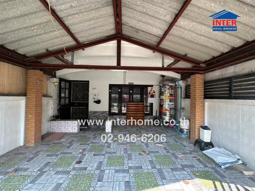 Spacious garage with tiled floor and organized storage area
