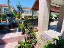 Well-maintained outdoor area of a residential property with a spiritual shrine and lush greenery