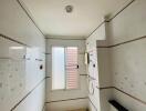 Modern bathroom with window and tiled walls