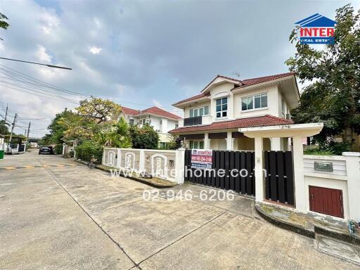 Suburban two-story house with a gated entrance