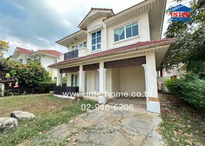 Spacious two-story house with a large yard and covered porch