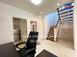 Spacious living room with staircase and modern design