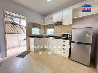 Spacious kitchen with modern appliances and ample storage