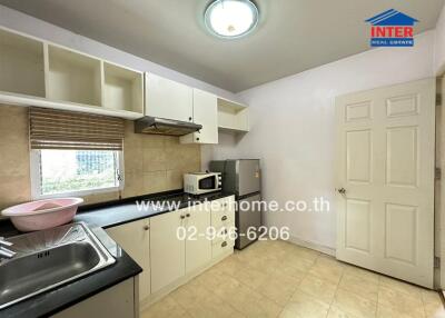 Compact kitchen with modern appliances and ample cabinetry