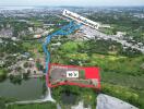 Aerial view of expansive property lot available for purchase, outlined in red